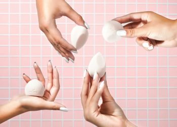 person holding white heart shaped ornament