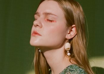woman in green and white floral shirt