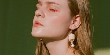 woman in green and white floral shirt