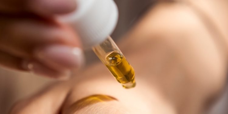 person holding dropper