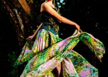 woman in green and purple floral dress