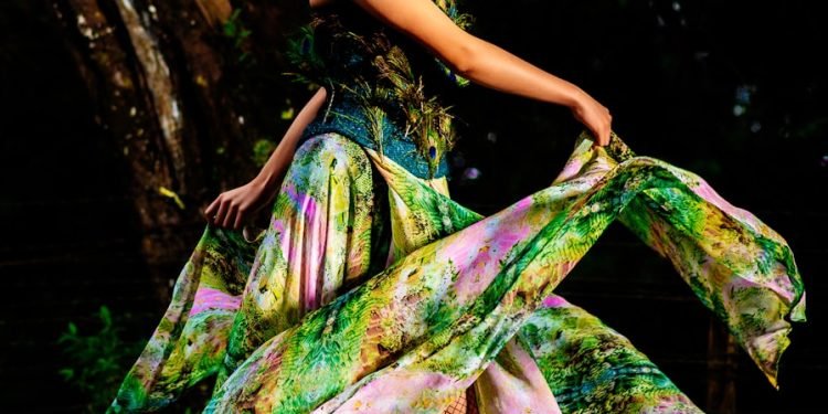 woman in green and purple floral dress