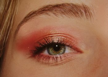 woman with pink and gold eyeshadow makeup