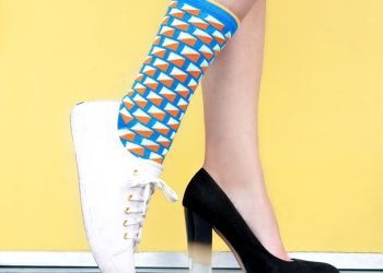 woman wearing sneaker and sandal