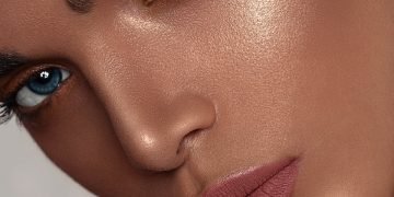 woman with red lipstick and gold hoop earrings