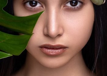 woman with green leaves on her head