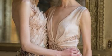 two women in beige dresses