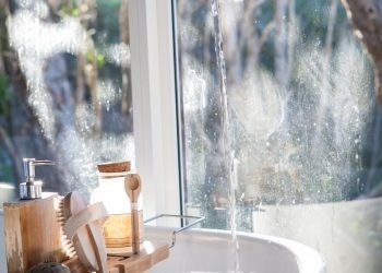 white ceramic sink beside window