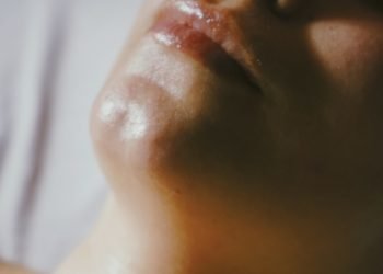 a woman getting a facial massage on her face