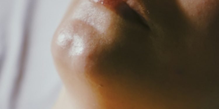 a woman getting a facial massage on her face