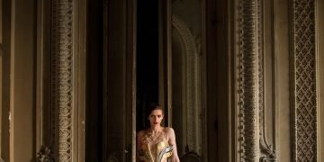 woman standing beside opened door