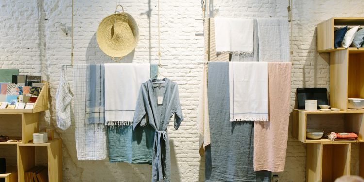 assorted-color towels hanging inside room