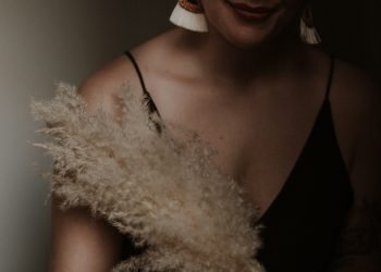 woman in black spaghetti strap top