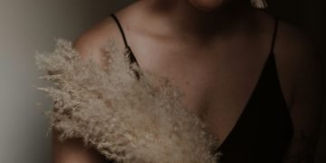 woman in black spaghetti strap top